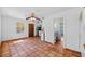 Open-concept living area featuring unique tile flooring with easy access to the kitchen and bathroom at 2110 Euclid Ter, Sarasota, FL 34239