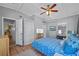 Main bedroom featuring tiled floors, a ceiling fan, and convenient access to the kitchen at 2110 Euclid Ter, Sarasota, FL 34239
