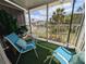 Relaxing balcony furnished with comfortable seating overlooking the well-maintained community grounds at 2340 Canal Dr # G-35, Bradenton, FL 34207