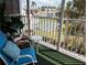 Comfortable balcony view showcasing a community with lush greenery and recreational facilities at 2340 Canal Dr # G-35, Bradenton, FL 34207