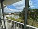 Charming balcony with views of the community's pool, shuffleboard, and landscaping at 2340 Canal Dr # G-35, Bradenton, FL 34207