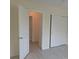 Cozy bedroom showcases fresh vinyl flooring, sliding closet doors, and neutral-toned walls, creating a blank canvas at 2340 Canal Dr # G-35, Bradenton, FL 34207