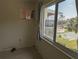 Cozy bedroom with outside view, features a window air conditioning unit for personalized climate control at 2340 Canal Dr # G-35, Bradenton, FL 34207