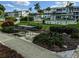Beautifully landscaped common area with picnic table and shuffleboard in the background at 2340 Canal Dr # G-35, Bradenton, FL 34207