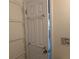Hallway featuring a white door with towel racks, adjacent to a wall with a decorative fish plate at 2340 Canal Dr # G-35, Bradenton, FL 34207