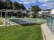 Community shuffleboard courts with benches and shade, perfect for outdoor fun at 2340 Canal Dr # G-35, Bradenton, FL 34207