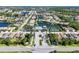 Aerial view of a Primary-planned community with community pool, tennis courts and neighborhood lakes at 2628 Sapphire Blue Ln, Bradenton, FL 34211