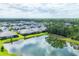 Aerial view of a community featuring a pond at 2628 Sapphire Blue Ln, Bradenton, FL 34211