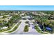 Aerial view of the community entrance, clubhouse and landscaping at 2628 Sapphire Blue Ln, Bradenton, FL 34211