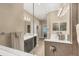Bathroom featuring double vanity, a shower, and bathtub at 2628 Sapphire Blue Ln, Bradenton, FL 34211