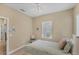 Bedroom with a window, ceiling fan, neutral walls, and light carpet at 2628 Sapphire Blue Ln, Bradenton, FL 34211