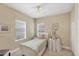 Cozy bedroom with natural light, a ceiling fan, and neutral wall paint at 2628 Sapphire Blue Ln, Bradenton, FL 34211