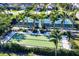 This community features tennis and bocce ball courts surrounded by tropical palm trees and lush landscaping at 2628 Sapphire Blue Ln, Bradenton, FL 34211