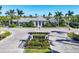Entrance of a housing community featuring decorative landscaping and gate at 2628 Sapphire Blue Ln, Bradenton, FL 34211