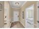 Inviting foyer featuring hardwood floors and views into the bedroom at 2628 Sapphire Blue Ln, Bradenton, FL 34211