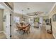 Bright and airy living space with wood floors, dining area, and an open view to the living room at 2628 Sapphire Blue Ln, Bradenton, FL 34211