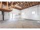 Unfinished basement with exposed rafters, painted walls, and concrete floor at 2703 Avenue B, Holmes Beach, FL 34217