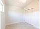 Bedroom featuring neutral carpet and ceiling fan with a large closet at 2703 Avenue B, Holmes Beach, FL 34217