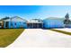Inviting home with a spacious driveway, screened porch, and a two-car garage at 2703 Avenue B, Holmes Beach, FL 34217