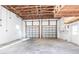 Spacious unfinished garage with two garage doors and white painted walls at 2703 Avenue B, Holmes Beach, FL 34217