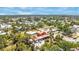 Expansive aerial view of the property showcasing its neighborhood, mature landscaping, and overall setting at 280 W Cowles St, Englewood, FL 34223