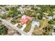 From above, see the home’s manicured lawn and proximity to another home featuring a screened-in pool at 280 W Cowles St, Englewood, FL 34223