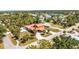 Aerial view of the home showcasing the large lot, covered parking, and landscaping at 280 W Cowles St, Englewood, FL 34223