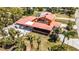 Aerial view of the home showcasing covered parking, a large lot, and updated roof at 280 W Cowles St, Englewood, FL 34223