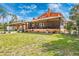 Large backyard featuring an expansive screened porch for relaxation and outdoor living at 280 W Cowles St, Englewood, FL 34223