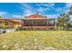 Large screened porch and lush backyard offer a serene outdoor retreat at 280 W Cowles St, Englewood, FL 34223