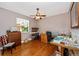 Bedroom with hardwood floors, ceiling fan, and a window at 280 W Cowles St, Englewood, FL 34223