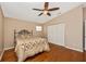 Bedroom features hardwood floors, a ceiling fan, and a built-in closet at 280 W Cowles St, Englewood, FL 34223