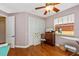 Bedroom boasts hardwood floors, a ceiling fan, and a built-in closet at 280 W Cowles St, Englewood, FL 34223