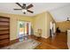 Bonus room with hardwood floors, a ceiling fan, and access to an outdoor balcony at 280 W Cowles St, Englewood, FL 34223