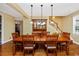 Charming dining room boasting hardwood floors, a wooden table with seating, and a vintage china cabinet at 280 W Cowles St, Englewood, FL 34223