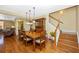 Hardwood floors, a wooden table with seating, and a charming china cabinet create a warm dining room ambiance at 280 W Cowles St, Englewood, FL 34223