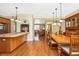 Spacious dining room featuring hardwood floors, a large table, and natural light at 280 W Cowles St, Englewood, FL 34223