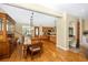 Dining area with hardwood floors, built-in cabinet and access to kitchen at 280 W Cowles St, Englewood, FL 34223