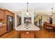 Bright kitchen island with tile countertop and view into the living areas at 280 W Cowles St, Englewood, FL 34223