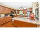 Well-equipped kitchen with wood cabinetry, stainless steel appliances, and tile countertops at 280 W Cowles St, Englewood, FL 34223