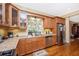 Updated kitchen featuring stainless steel appliances and bright window over sink at 280 W Cowles St, Englewood, FL 34223