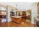 Open-concept kitchen with wood cabinets, tiled island, and stainless steel appliances at 280 W Cowles St, Englewood, FL 34223