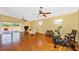 Bright living room featuring hardwood floors, ceiling fan, and sliding door access to patio at 280 W Cowles St, Englewood, FL 34223