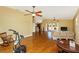 Spacious living room with hardwood floors, ceiling fan, and sliding door access to patio at 280 W Cowles St, Englewood, FL 34223