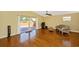 Bright living room with hardwood floors and sliding door access to an outdoor patio at 280 W Cowles St, Englewood, FL 34223