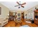 Cozy living room with a fireplace, hardwood floors, and comfortable seating at 280 W Cowles St, Englewood, FL 34223