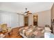 This bedroom features hardwood floors, a ceiling fan, and a closet at 280 W Cowles St, Englewood, FL 34223