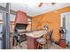 This outdoor kitchen features a built-in grill and mini-fridge at 280 W Cowles St, Englewood, FL 34223