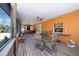 This covered patio has a fan, grill, and lots of space at 280 W Cowles St, Englewood, FL 34223