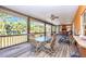 The patio has a ceiling fan and a grill for entertaining at 280 W Cowles St, Englewood, FL 34223